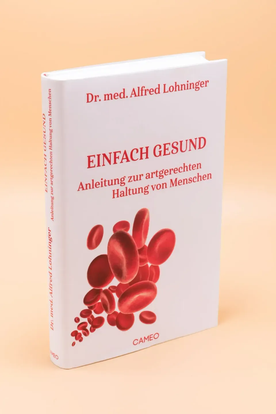 Buch 'Einfach gesund' von Dr. med. Alfred Lohninger mit roten Blutkörperchen auf weißem Cover – professionelle Produktfotogra